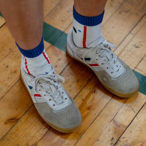 Close up of sports shoes on a light wooden floor
