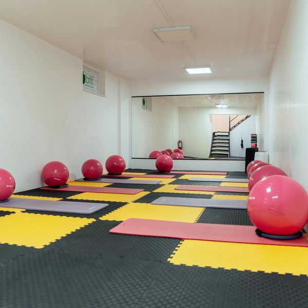 Empty bright room with a single exercise mat