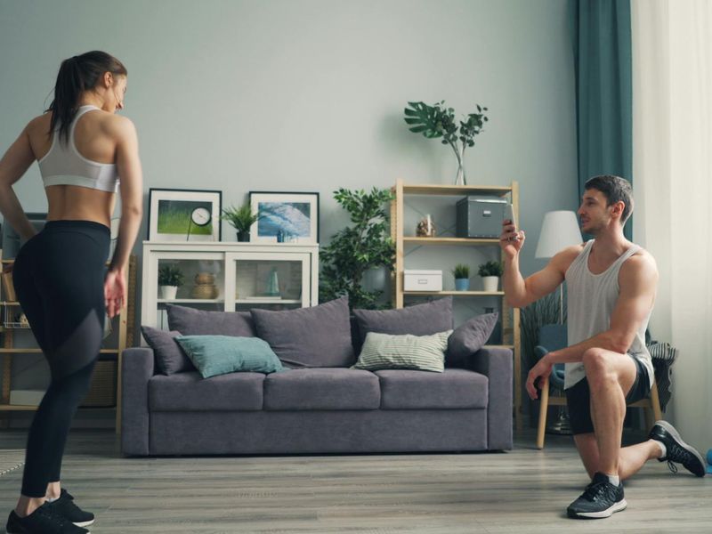 Person doing dynamic cardio exercise in a bright minimal room